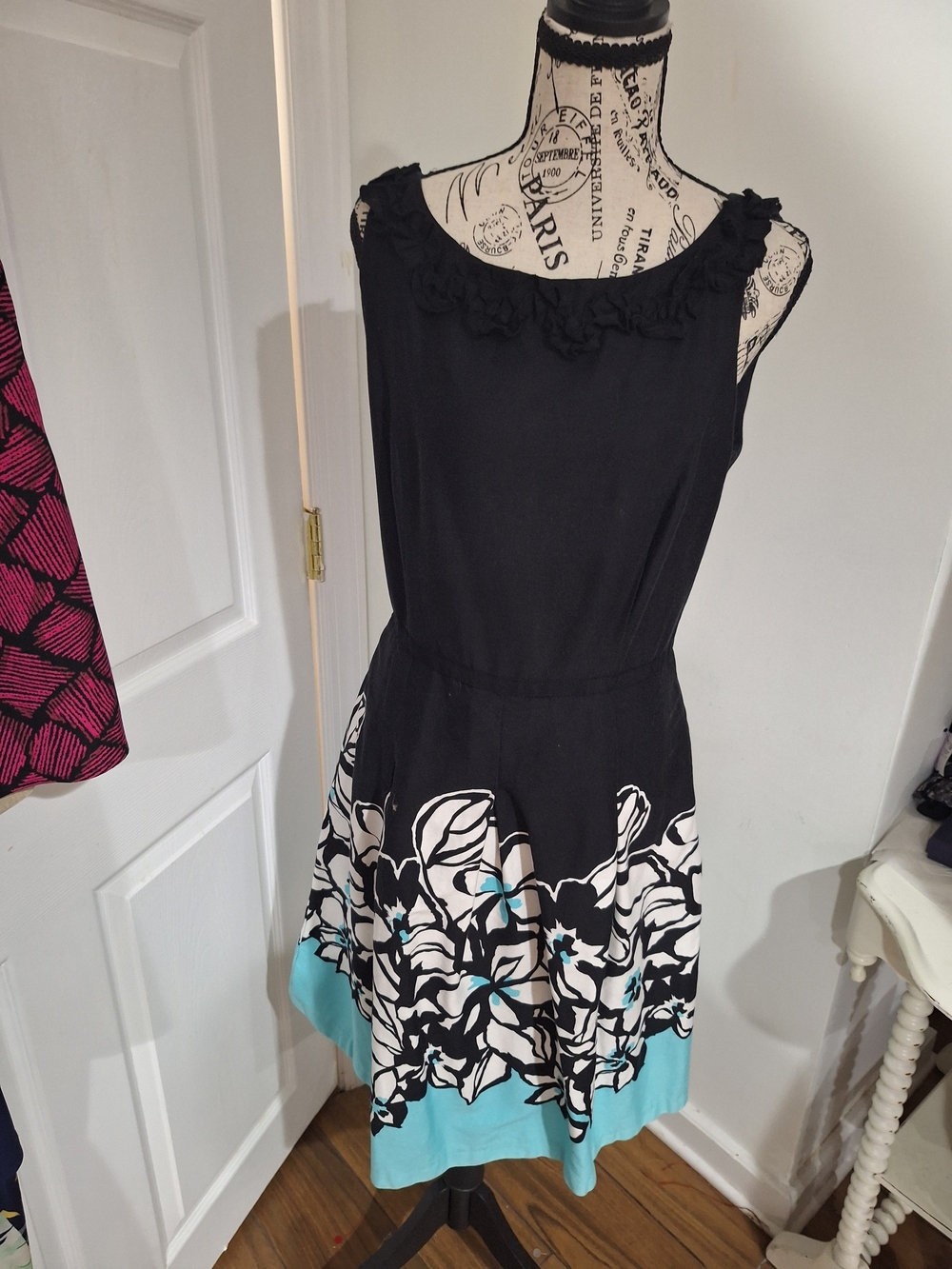 Danny & Nicole Black Dress with White Floral and Teal Hem